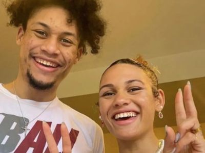 Both DJ Rodman and Trinity Rodman are smiling for the picture showing peace sign.